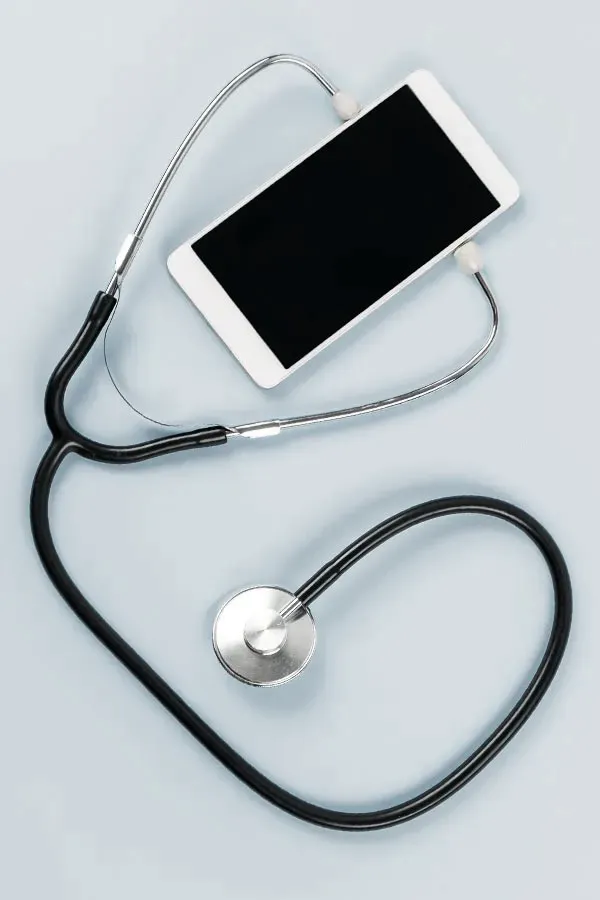 Telemedicine-Treatment A smartphone with a stethoscope attached to it, symbolizing Telemedicine treatment from Raving Health in Virginia Beach.